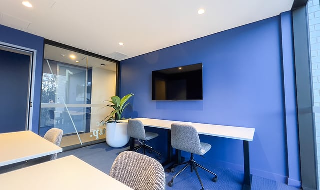 Desks chairs plant television study area at The Switch Kensington in Sydney Student Accommodation