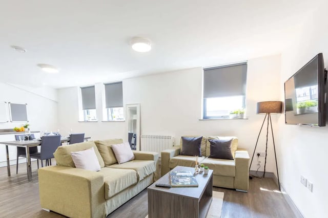 Sofa coffee table floor lamp living room at The Foundry in Leeds Student Accommodation