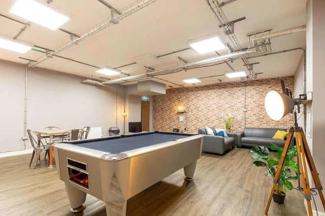 Pool table dining tables sofas living room at The Foundry in Leeds Student Accommodation