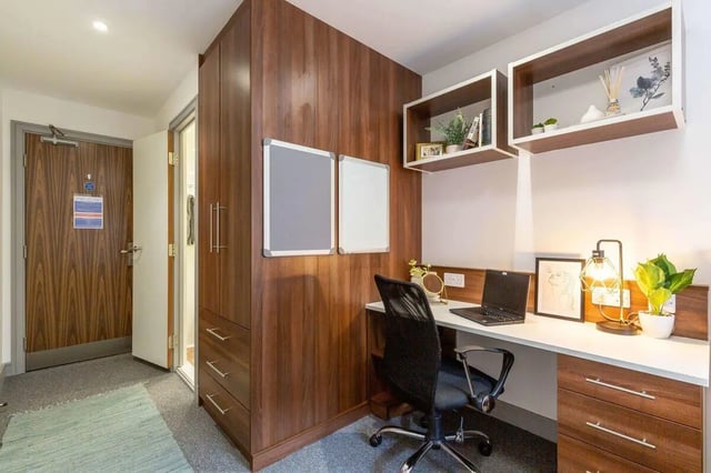 Desk whiteboard shelves and wardrobe study area at The Foundry in Leeds Student Accommodation