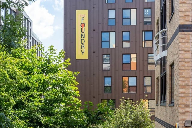Brown building exterior windows and green foliage exterior at The Foundry in Leeds Student Accommodation