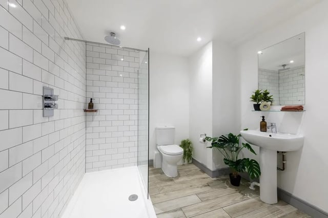 Shower toilet sink plants and mirror bathroom at The Foundry in Leeds Student Accommodation