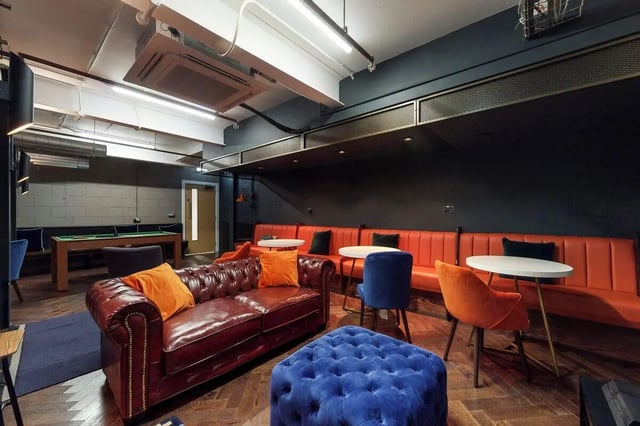 Chesterfield sofa pool table seating area living room at Haymarket Edinburgh in Edinburgh Student Accommodation