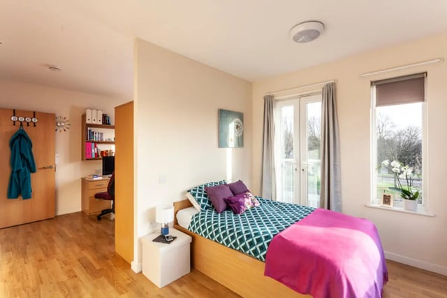 Bed with teal and white pattern duvet bedroom at Metchley Hall in Birmingham Student Accommodation