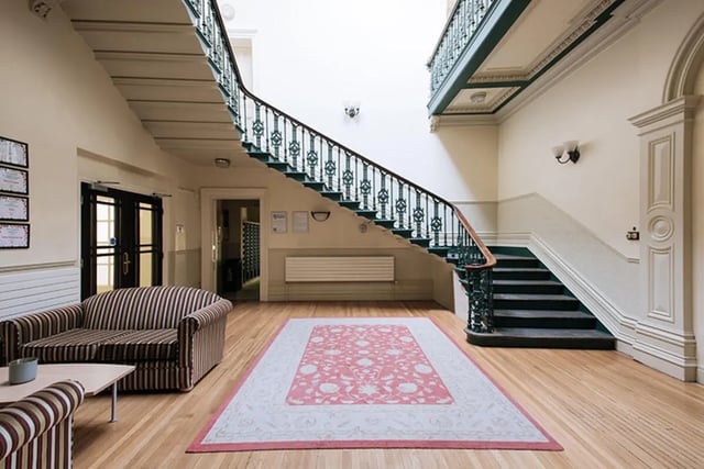 Sofa rug staircase and doors communal area at Oxley Residence in Leeds Student Accommodation