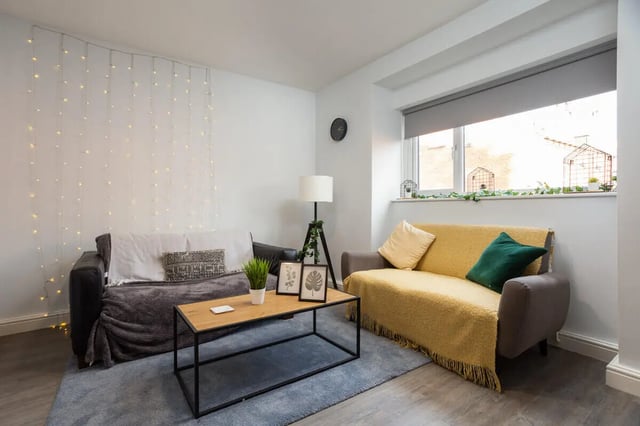 Two sofas string lights coffee table living room at Thornville Court Leeds in Leeds Student Accommodation