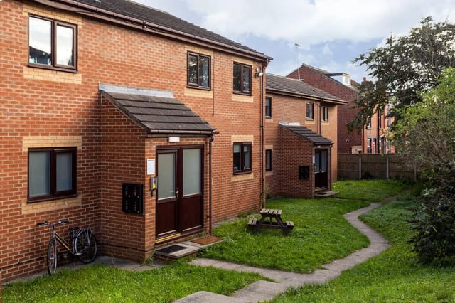 Brick buildings with picnic table and bicycle exterior at Thornville Court Leeds in Leeds Student Accommodation