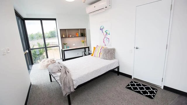 Bed desk and artwork in student bedroom at UniLodge Park Central in Brisbane Student Accommodation