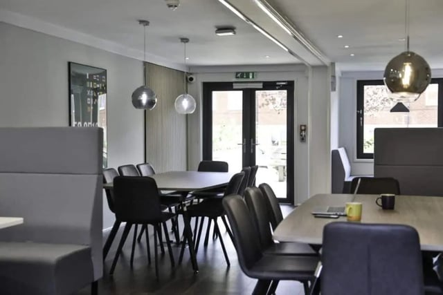 Dining tables with chairs and booths communal area at Madison Gardens in Nottingham Student Accommodation