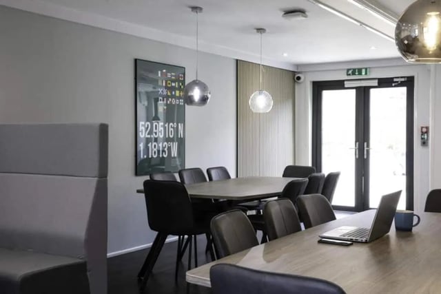 Dining tables with chairs and laptop living room at Madison Gardens in Nottingham Student Accommodation