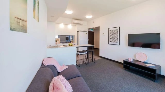 Sofa kitchen bar TV living room at UniLodge Park Central in Brisbane Student Accommodation