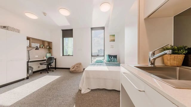 Bed desk chair beanbag sink kitchen bedroom at UniLodge Park Central in Brisbane Student Accommodation