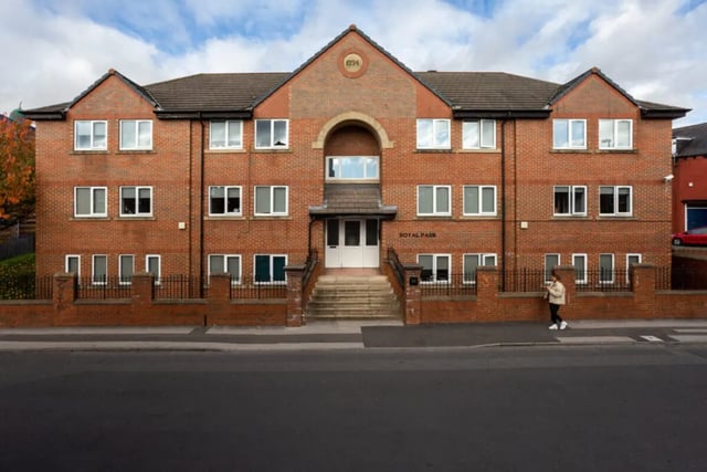 Brick building with many windows and stairs exterior at Royal Park Road in Leeds Student Accommodation
