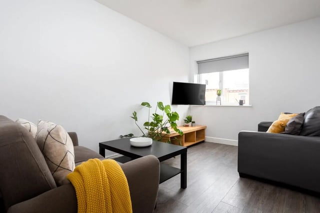 Two sofas TV plant and coffee table living room at Royal Park Road in Leeds Student Accommodation
