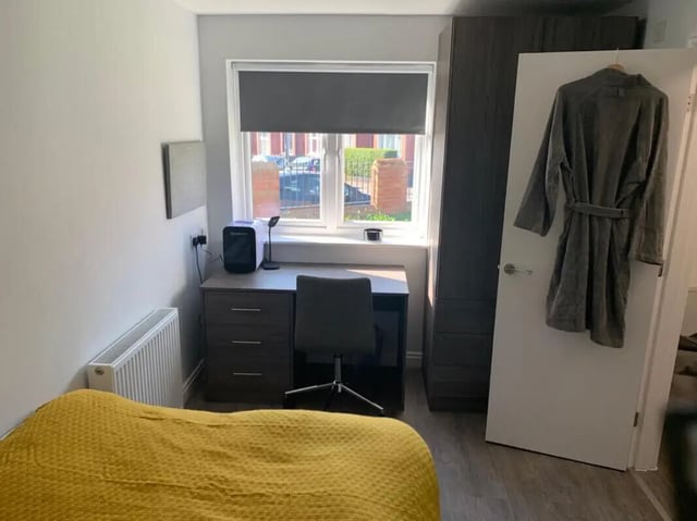 Bed desk wardrobe and dressing gown bedroom at Welton Road in Leeds Student Accommodation
