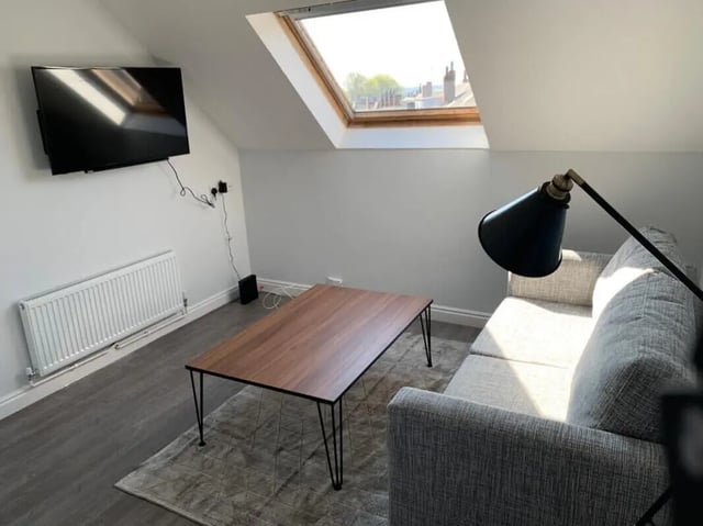 Sofa coffee table television and skylight living room at Welton Road in Leeds Student Accommodation