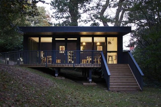 Modern cabin with deck tables and chairs exterior at Beech Gardens in Birmingham Student Accommodation
