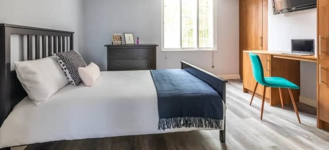 Bed dresser desk laptop teal chair Bedroom at Standard Hill in Nottingham Student Accommodation