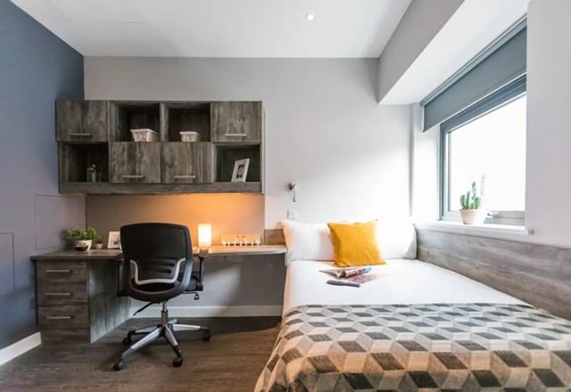 Desk chair bed storage and window bedroom at Queens Court in Reading Student Accommodation