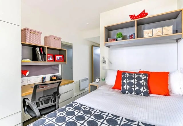 Bed desk storage boxes and chair bedroom at The Cam Foundry in Cambridge Student Accommodation