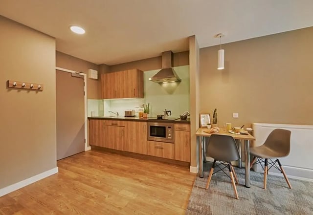 Kitchen with table chairs and microwave kitchen at The Combworks in Aberdeen Student Accommodation
