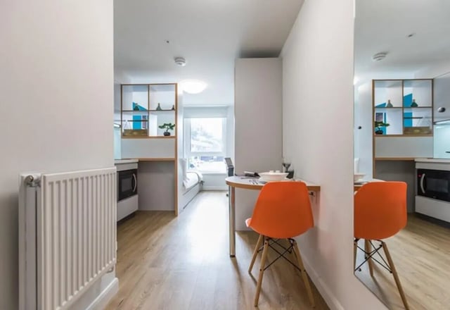 Studio apartment with kitchenette dining area bedroom at Stoneworks in Brighton Student Accommodation