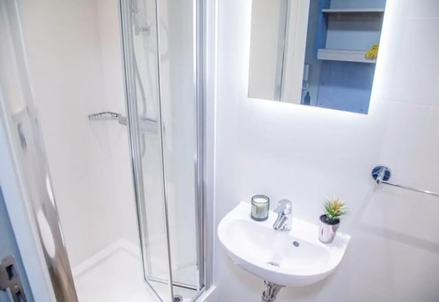 Shower cubicle sink and mirror bathroom at Caton Court in Lancaster Student Accommodation