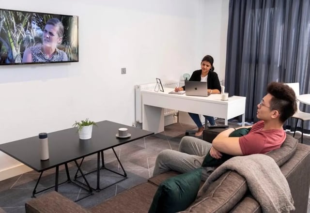 Students relaxing and working living room at aparto Glasgow West End in Glasgow Student Accommodation