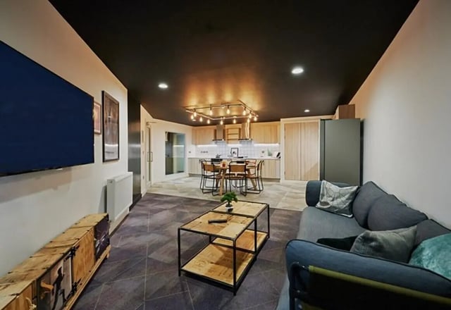 Sofa coffee table TV kitchen dining area living room at aparto Glasgow West End in Glasgow Student Accommodation