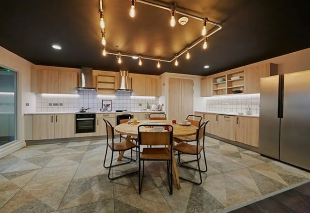 Wooden cabinets oven chairs table kitchen at aparto Glasgow West End in Glasgow Student Accommodation