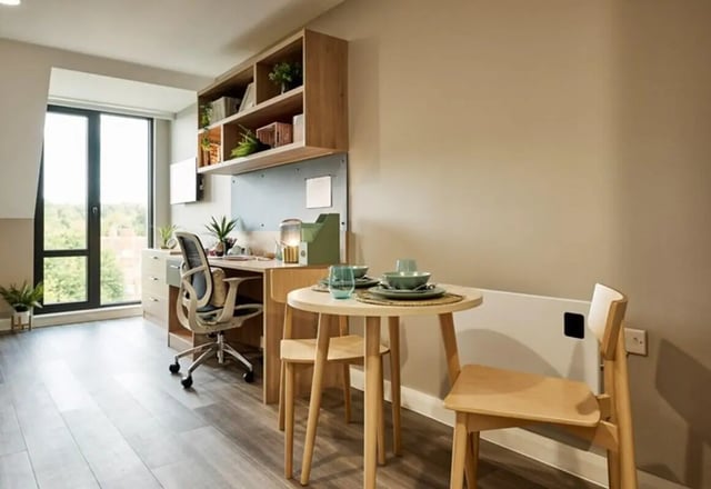 Desk chair table and shelves study area at The Spireworks in Oxford Student Accommodation