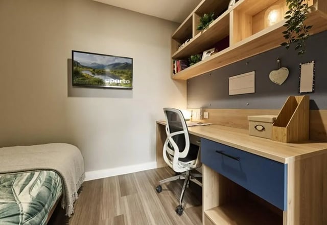 Desk chair shelving bed with TV study bedroom at The Spireworks in Oxford Student Accommodation