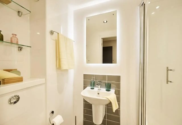 Sink mirror towel rack and shower Bathroom at The Spireworks in Oxford Student Accommodation