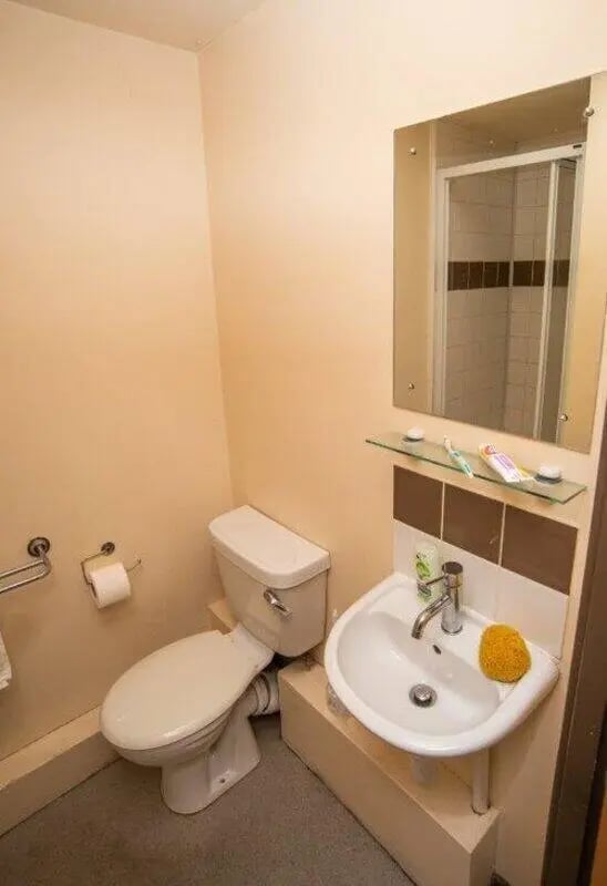 Toilet sink mirror and shower cubicle bathroom at Asha House in Loughborough Student Accommodation