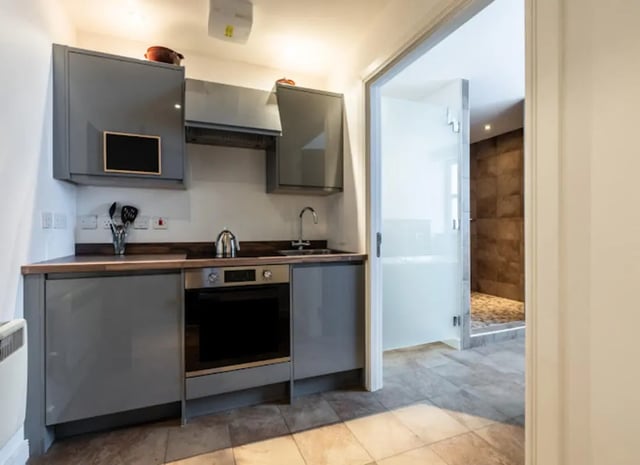 Grey cabinets oven kettle sink interior kitchen at Bauhaus Student Langstane Place in Aberdeen Student Accommodation