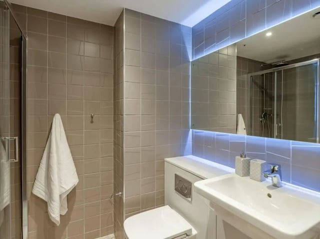Modern bathroom with sink toilet shower bathroom at True Swansea in Swansea Student Accommodation