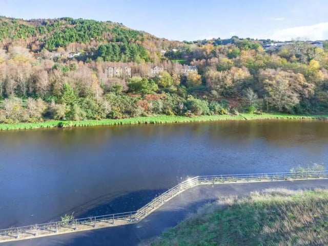 Waterfront buildings on wooded hillside exterior at True Swansea in Swansea Student Accommodation