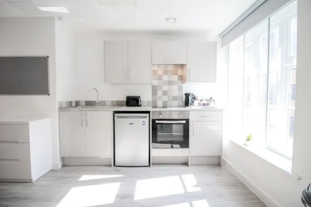 Modern white kitchen with oven toaster and fridge kitchen at Stanley House Nottingham in Nottingham Student Accommodation