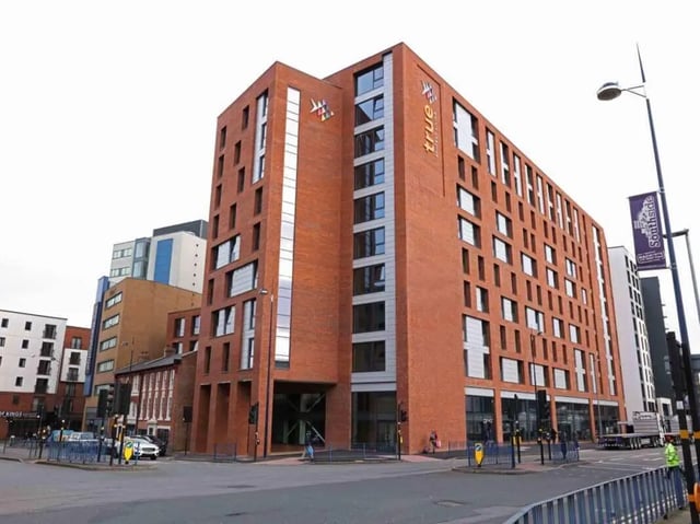 Brick building with windows and true logo exterior at True Birmingham in Birmingham Student Accommodation