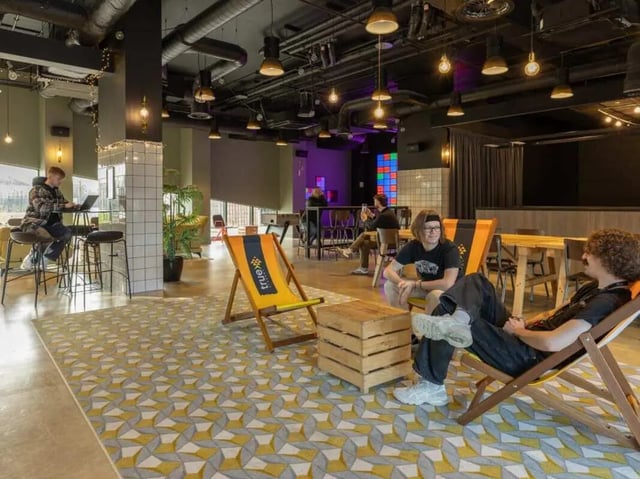 People relaxing on chairs living room area at True Manchester-Salford in Salford Student Accommodation