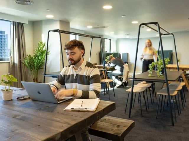 Students working in communal study area at True Manchester-Salford in Salford Student Accommodation