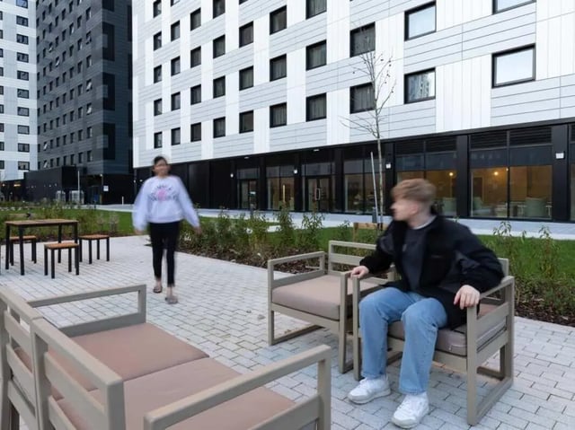 Outdoor seating area with modern buildings exterior at True Manchester-Salford in Salford Student Accommodation