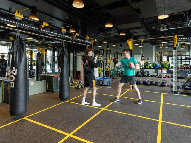 Boxing bags and two people training gym area at True Manchester-Salford in Salford Student Accommodation