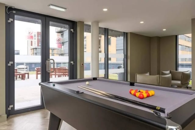 Pool table with balls and cues Game Room at The Lyra in London Student Accommodation