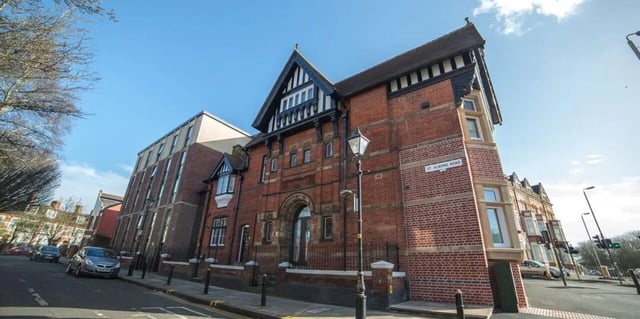 Brick building with windows and street exterior at The Bank Leicester in Leicester Student Accommodation