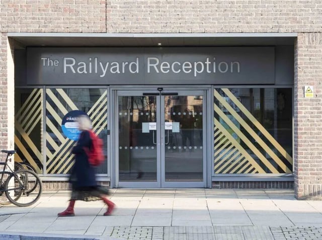 Entrance with Railyard Reception signage and glass doors exterior at The Railyard Cambridge in Cambridge Student Accommodation