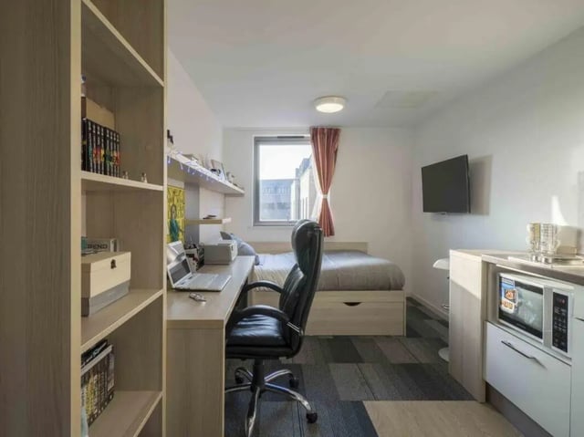Bed desk chair microwave shelf student room at The Railyard Cambridge in Cambridge Student Accommodation