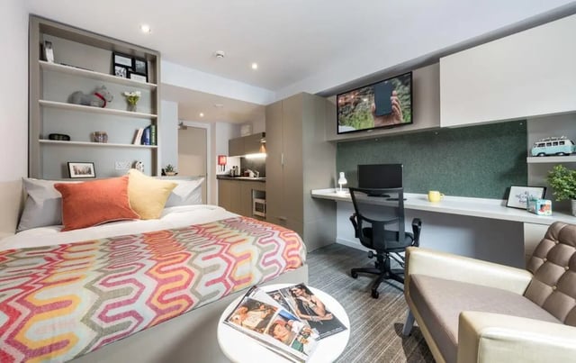 Bed desk shelving and kitchen area bedroom at The Kingfisher in Exeter Student Accommodation