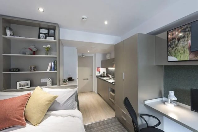 Bed kitchen shelves desk television studio apartment at The Kingfisher in Exeter Student Accommodation