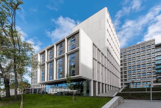 Modern student accommodation building exterior with grass exterior at CitySide in Leeds Student Accommodation